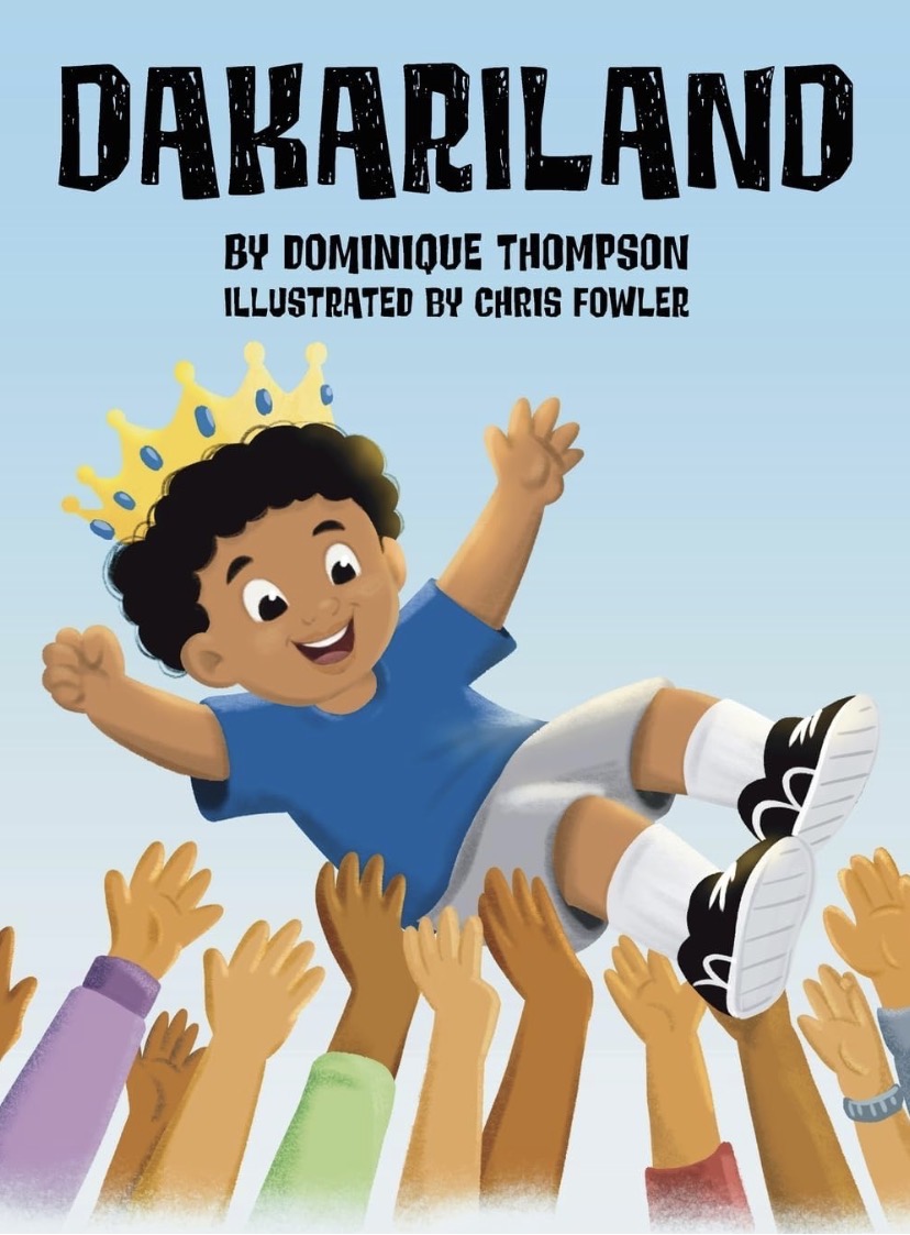 Dakariland by Dominique Thompson, illustrated by Chris Fowler. The cover shows King Dakari joyfully lifted by helping hands.